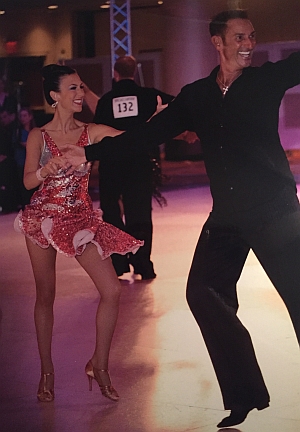 Man and woman competing in ballroom dance